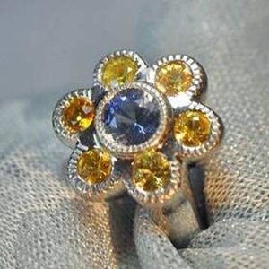 Platinum custom made blue and yellow ring
